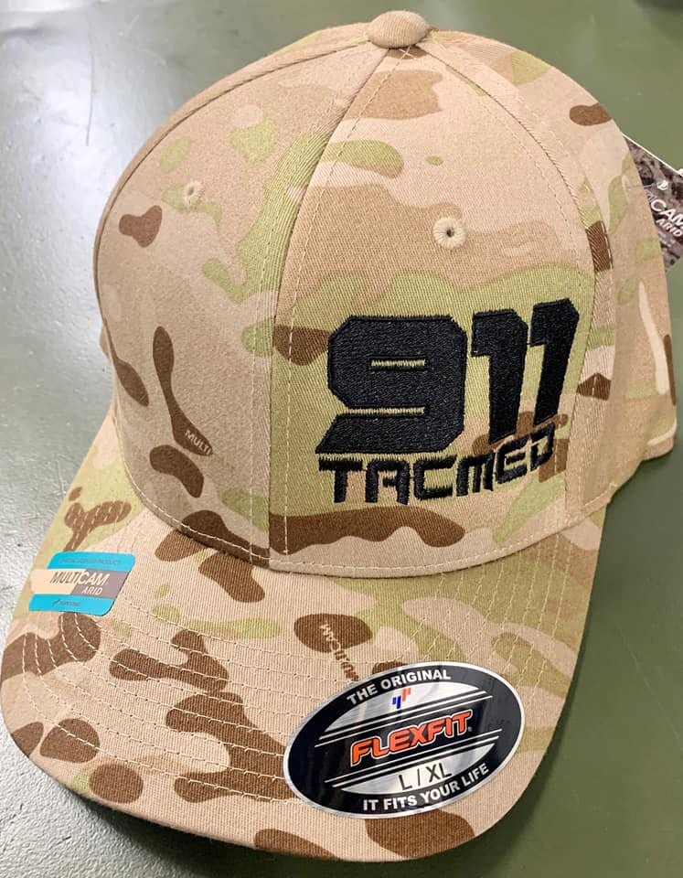Camouflage baseball cap with an embroidered design.